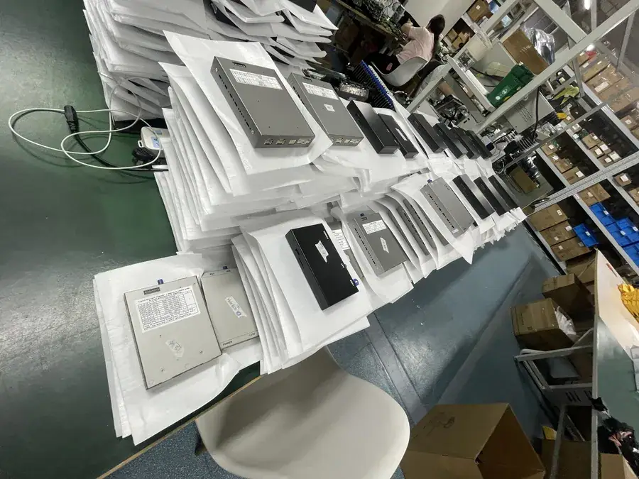Batch of CarPlay decoder modules laid out on anti-static trays before packing