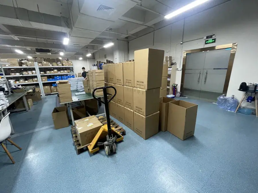 Palletised CarPlay decoder modules in the factory warehouse ready for wholesale shipment