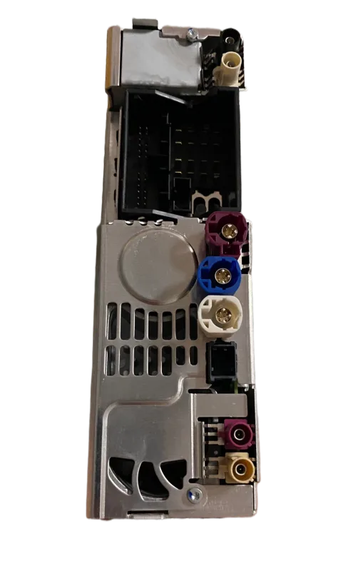 Rear connector panel of a factory head unit showing the fixed power and video sockets a CarPlay retrofit module plugs into