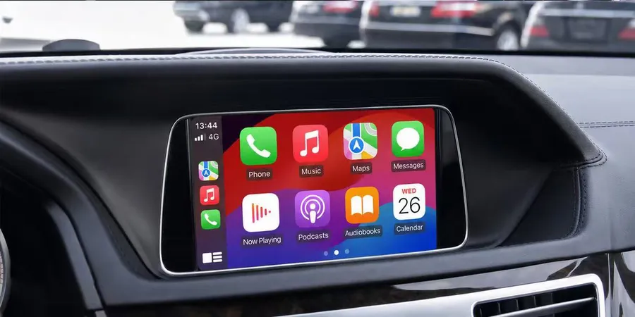 The same Mercedes GLA factory screen showing wireless CarPlay after the decoder module install, OEM screen retained