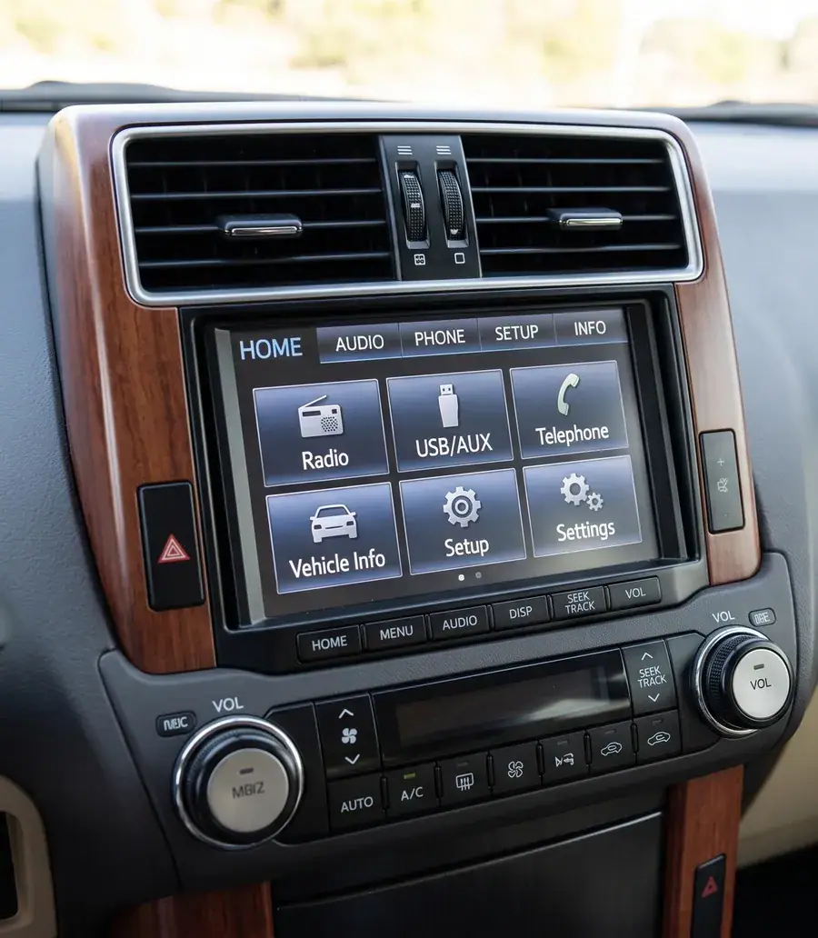 Toyota Land Cruiser 150 factory centre stack with original Entune screen before a CarPlay decoder module is fitted